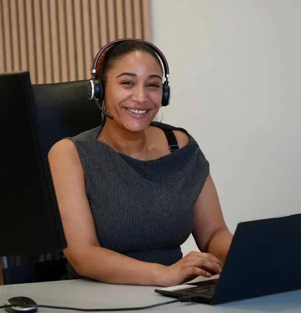 SolarFast team member at a laptop