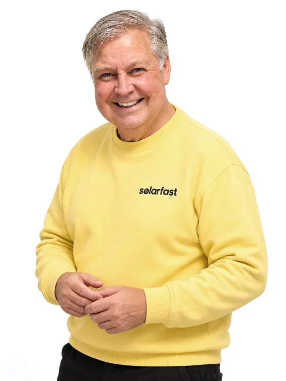 Hans, SolarFast advisor, in a yellow SolarFast sweater